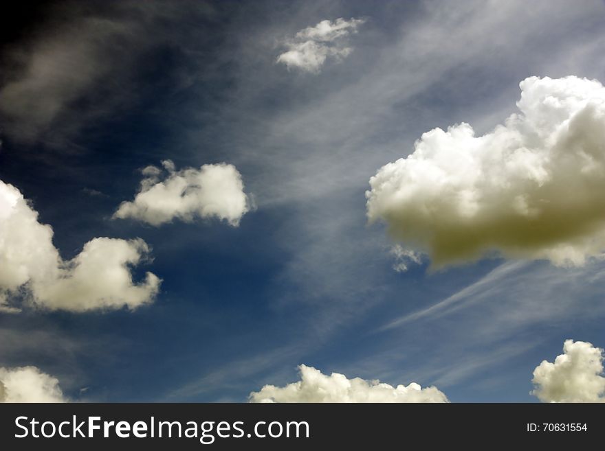 Fluffy white clouds in the blue sky. Fluffy white clouds in the blue sky