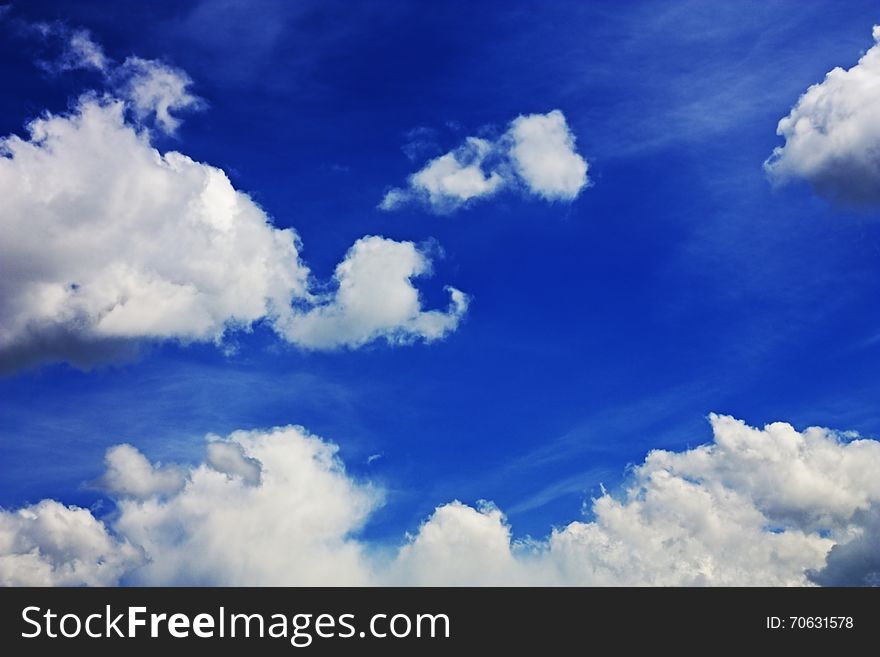 Fluffy white clouds in the blue sky. Fluffy white clouds in the blue sky