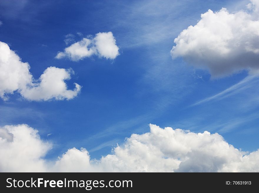 Fluffy white clouds in the blue sky. Fluffy white clouds in the blue sky