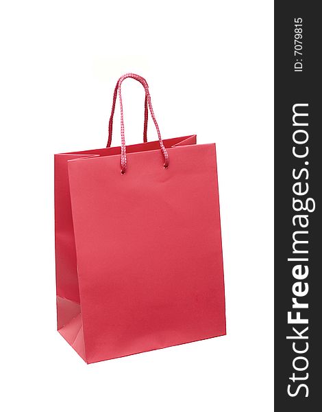 The red package for purchases is isolated on a white background. The red package for purchases is isolated on a white background.