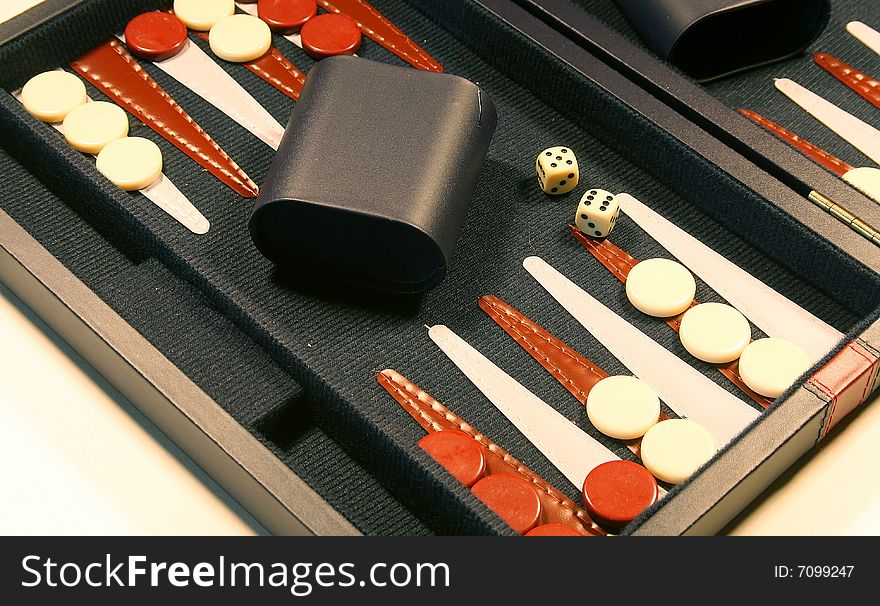 Backgammon board with dice cups and counters