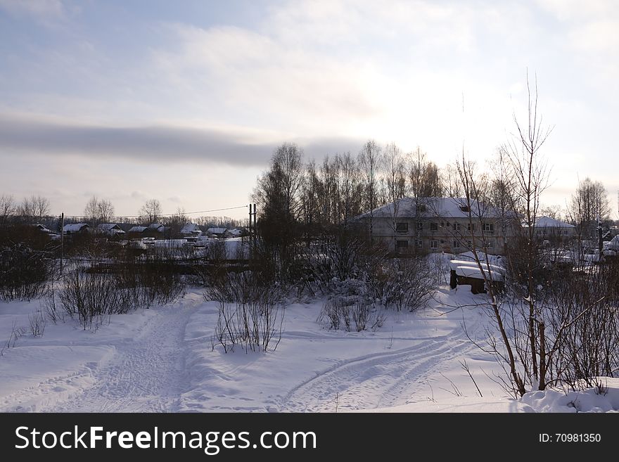 Village in a winter day and snow