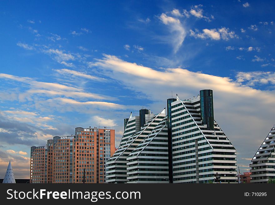 Modern buildings and a nice blue sky with clouds