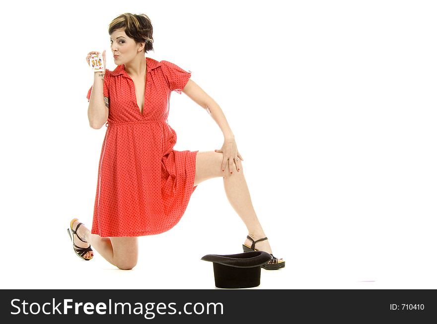 young actress with tattoos, a red girlish dress, poses different postures and expressions for an audition, with playing cards and a big black hat, over a white background. young actress with tattoos, a red girlish dress, poses different postures and expressions for an audition, with playing cards and a big black hat, over a white background