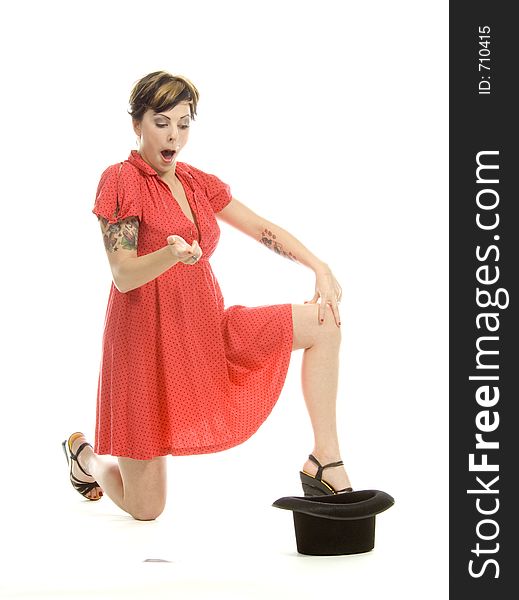 young actress with tattoos, a red girlish dress, poses different postures and expressions for an audition, with playing cards and a big black hat, over a white background. young actress with tattoos, a red girlish dress, poses different postures and expressions for an audition, with playing cards and a big black hat, over a white background