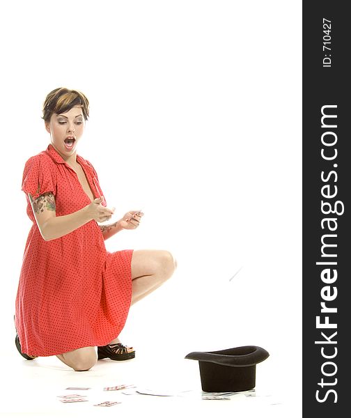 young actress with tattoos, a red girlish dress, poses different postures and expressions for an audition, with playing cards and a big black hat, over a white background. young actress with tattoos, a red girlish dress, poses different postures and expressions for an audition, with playing cards and a big black hat, over a white background