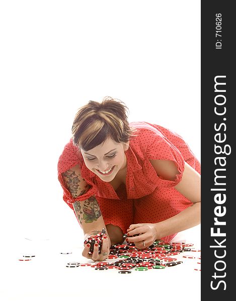 young actress with tattoos, a red girlish dress, poses different postures and expressions for an audition, with tokens in front of her, down on the white floor. young actress with tattoos, a red girlish dress, poses different postures and expressions for an audition, with tokens in front of her, down on the white floor