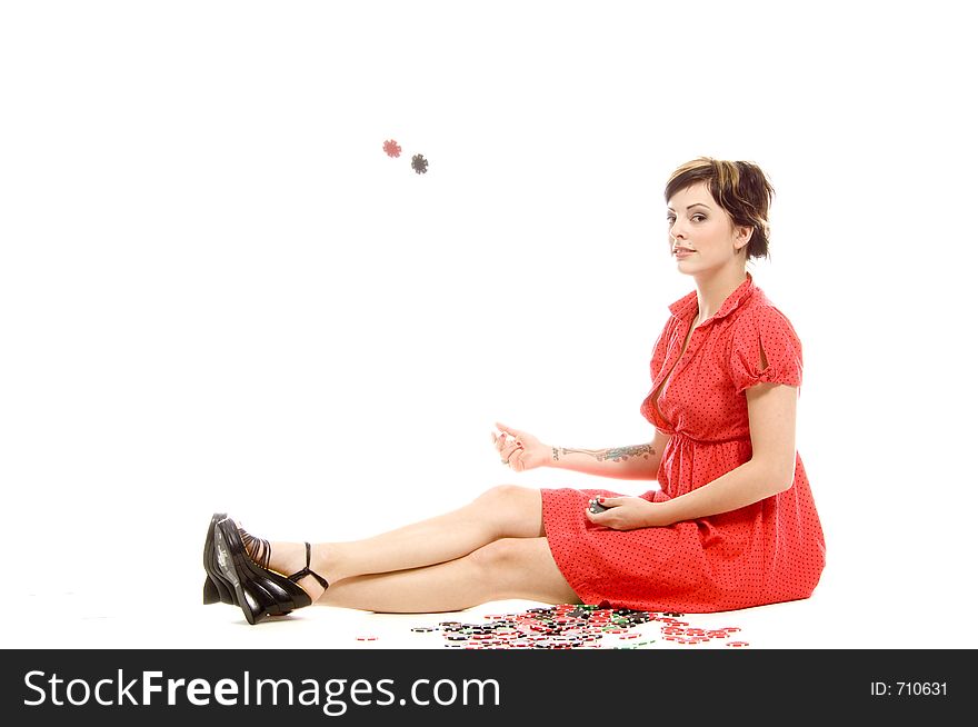 young actress with tattoos, a red girlish dress, poses different postures and expressions for an audition, throwing dices, over a white background. young actress with tattoos, a red girlish dress, poses different postures and expressions for an audition, throwing dices, over a white background