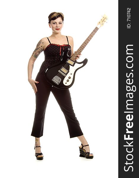 Woman in her thirties playing electric guitar. Woman in her thirties playing electric guitar