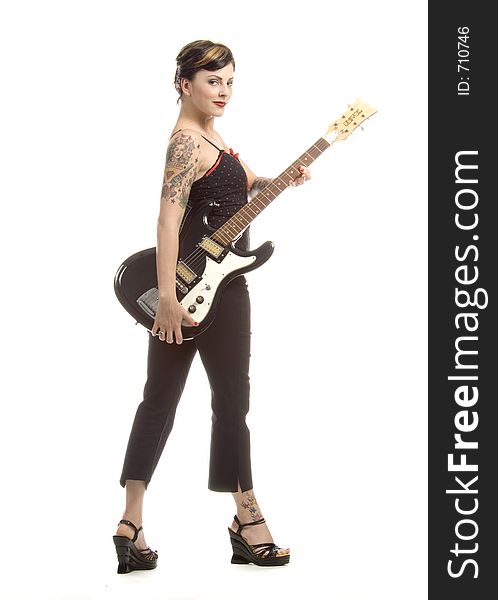 Woman in her thirties playing electric guitar. Woman in her thirties playing electric guitar