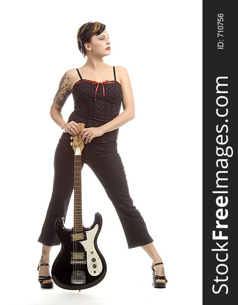 Woman in her thirties playing music on electric guitar. Woman in her thirties playing music on electric guitar