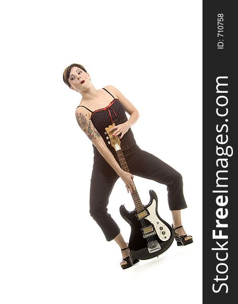 Woman in her thirties playing music on electric guitar. Woman in her thirties playing music on electric guitar