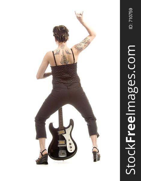 Woman in her thirties playing music on electric guitar. Woman in her thirties playing music on electric guitar