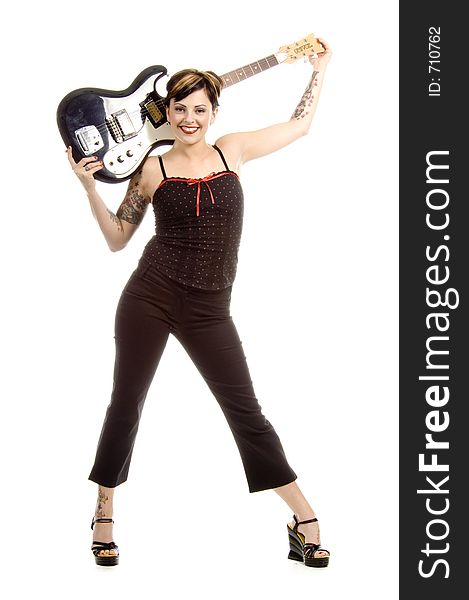 Woman in her thirties playing music on electric guitar. Woman in her thirties playing music on electric guitar