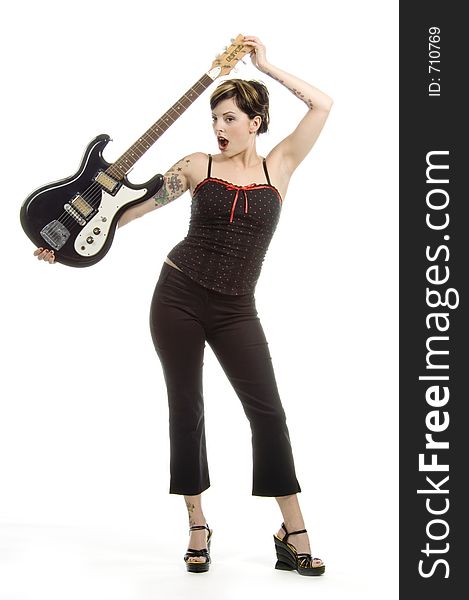 Woman in her thirties playing music on electric guitar. Woman in her thirties playing music on electric guitar