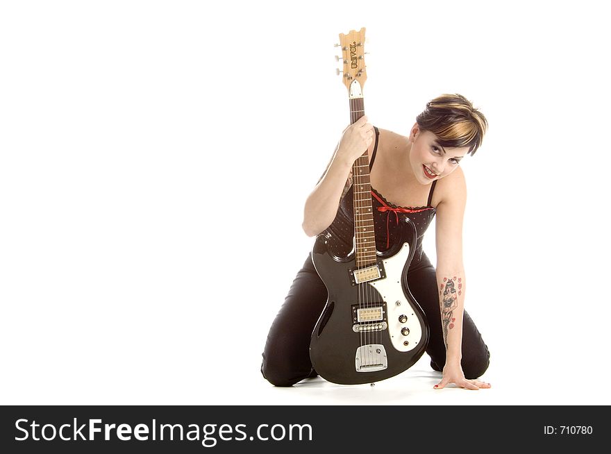 Woman in her thirties playing music on electric guitar. Woman in her thirties playing music on electric guitar