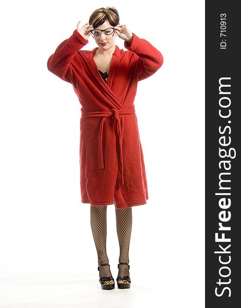 Youg woman in red bathrobe taking off her glasses. Youg woman in red bathrobe taking off her glasses