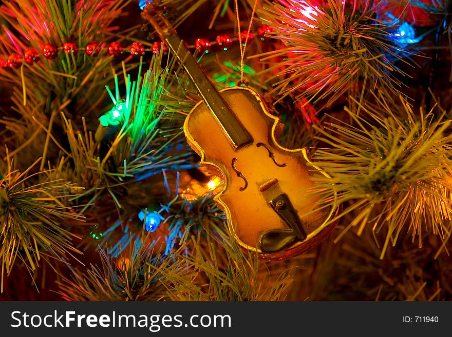 Christmas tree with violin ornament. Christmas tree with violin ornament