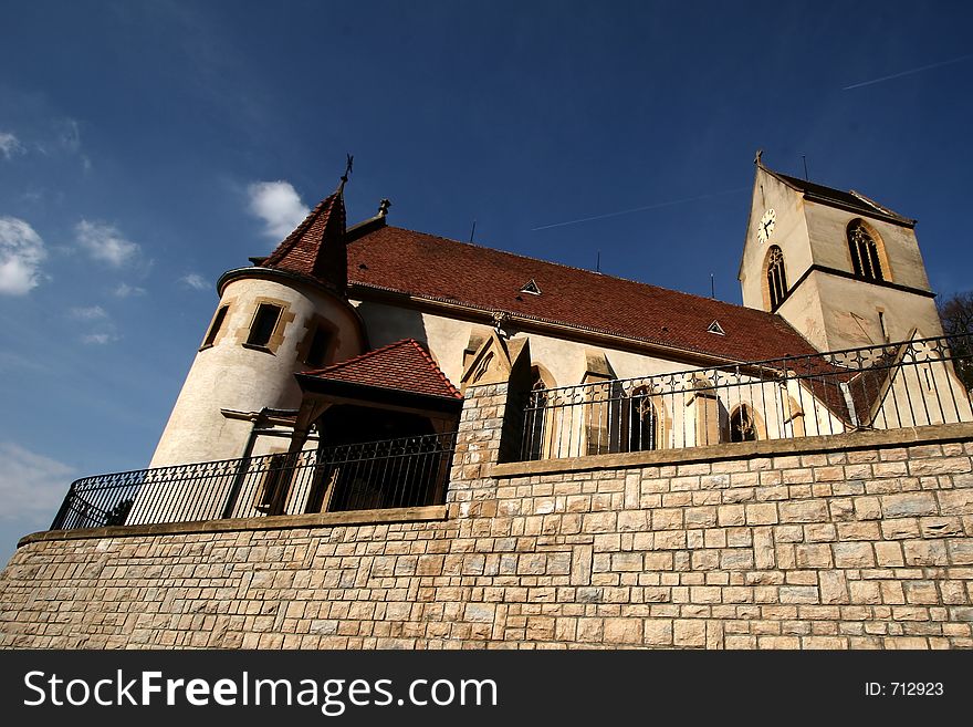 Church in the street of a alsacian villlage in the summer. Church in the street of a alsacian villlage in the summer