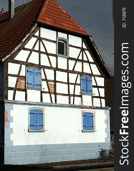 In the street of a alsacian villlage in the summer, half timbered traditional house. In the street of a alsacian villlage in the summer, half timbered traditional house