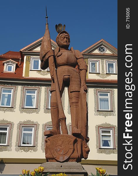 You can find this medieval knight on top of a fountain on the market square in a town in southern Germany on a bright spring day.