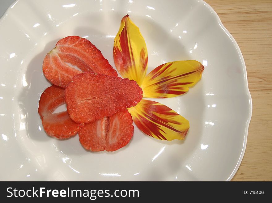 Sliced strawberry dessert with tulip decoration