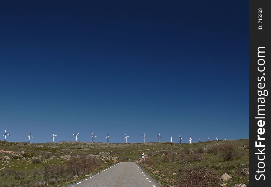 Line of Wind Turbines under Deep Blue Spanish Sky. Line of Wind Turbines under Deep Blue Spanish Sky