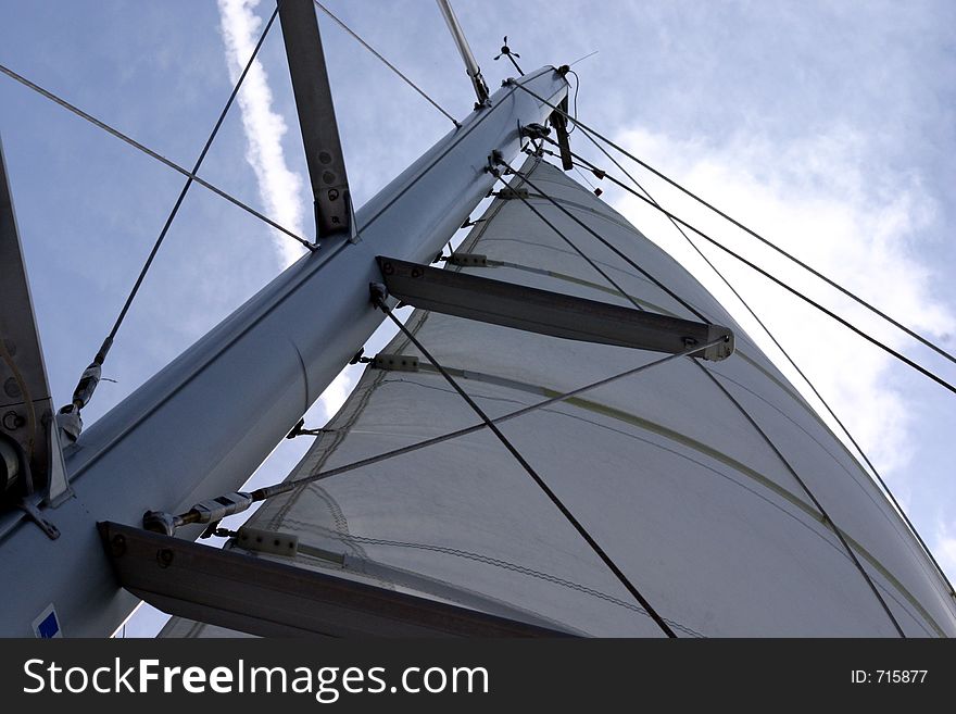 A view of the a salboat sail from the base of the mast. A view of the a salboat sail from the base of the mast
