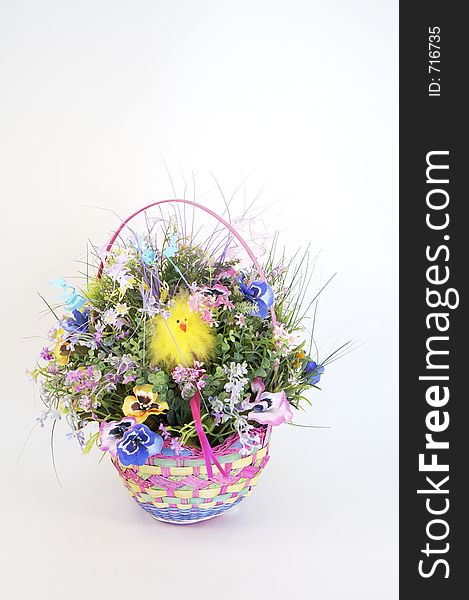 An easter basket of spring flowers. An easter basket of spring flowers.