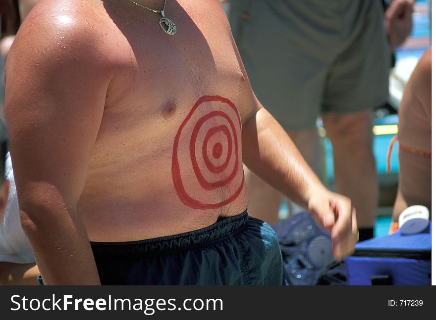 Man wearing a bull's eye on chest