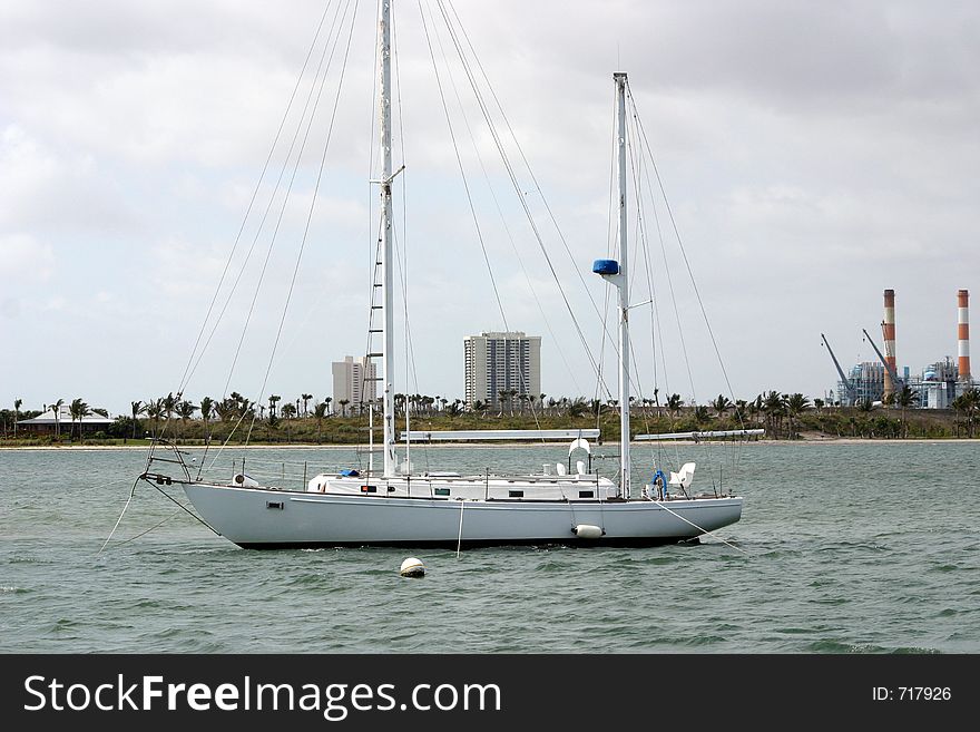 A sideview of an anchored sailboat yacht. A sideview of an anchored sailboat yacht