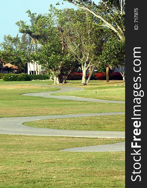 The windy path for a golf cart at a country club. The windy path for a golf cart at a country club