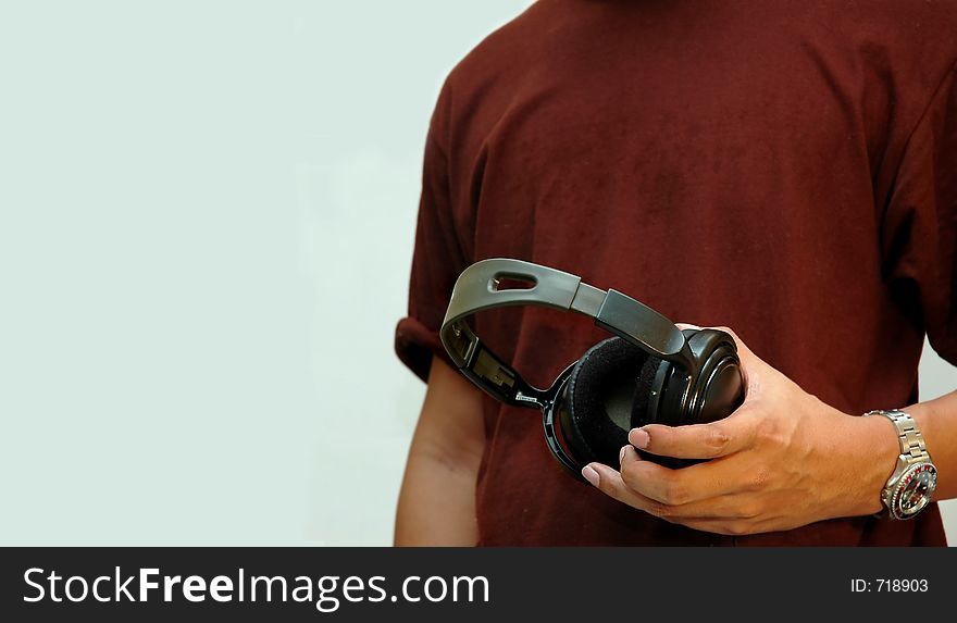 Closeup man holding earphone