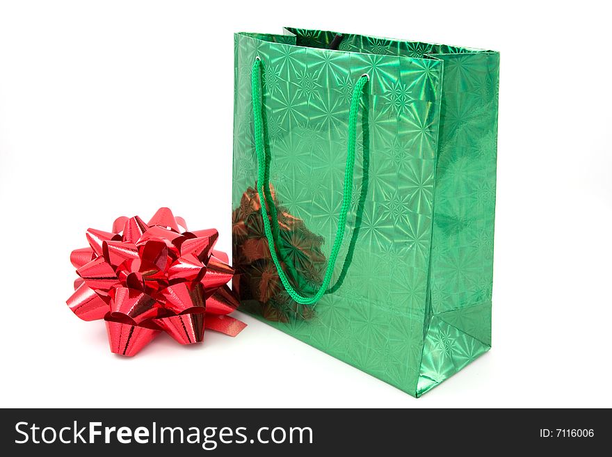 Green package and red bow on isolated. Green package and red bow on isolated