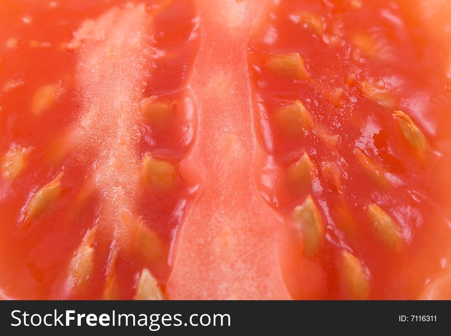 Slices red tomato - macro background .