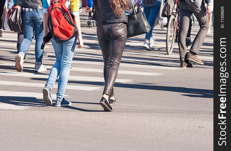 Pedestrians walking on a crosswalk