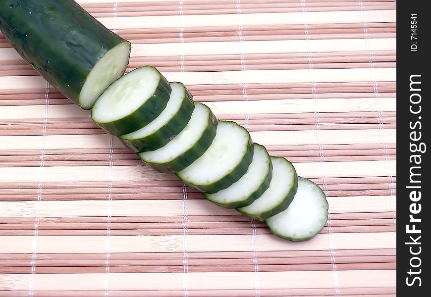 Cut cucumber slices, photography in the foreground