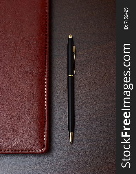 Business style: daily with leather cover and a black pen