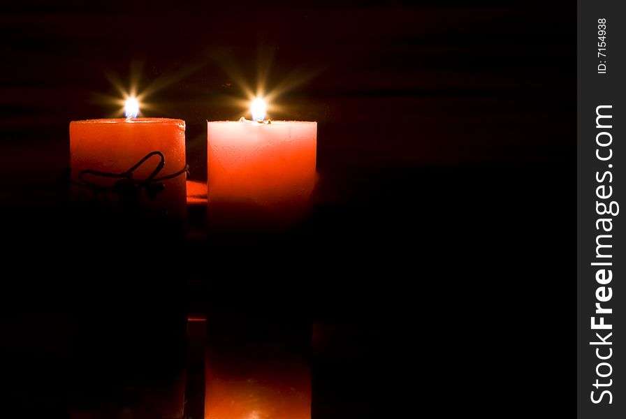 Red candles on dark background