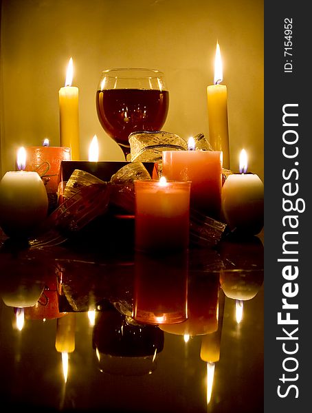 Christmas gifts , candles and red wine. Christmas gifts , candles and red wine