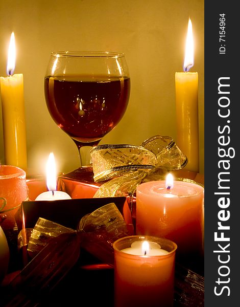 Christmas gifts , candles and red wine. Christmas gifts , candles and red wine