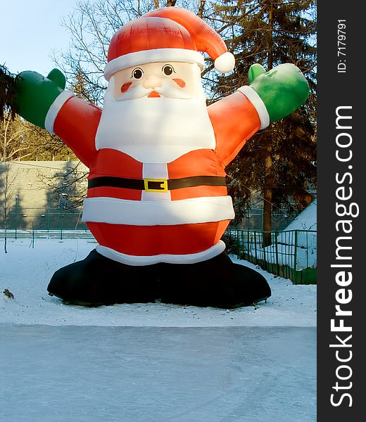 Happy Christmas Santa. In the winter on skating rink