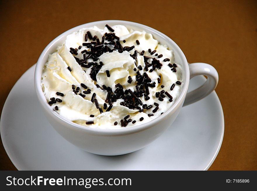 Hot cocoa with whipped cream and chocolate sprinkles