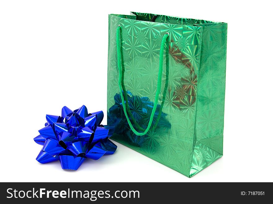 Green package and blue bow on isolated. Green package and blue bow on isolated