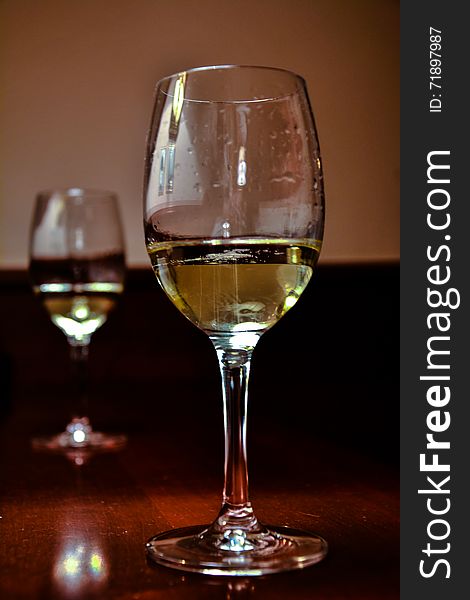 Glasses of white wine, alcohol, the glass. Glasses of white wine, alcohol, the glass