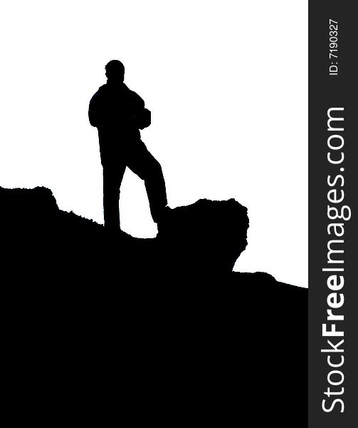 The silhouette of the man which stands on mountain. The silhouette of the man which stands on mountain