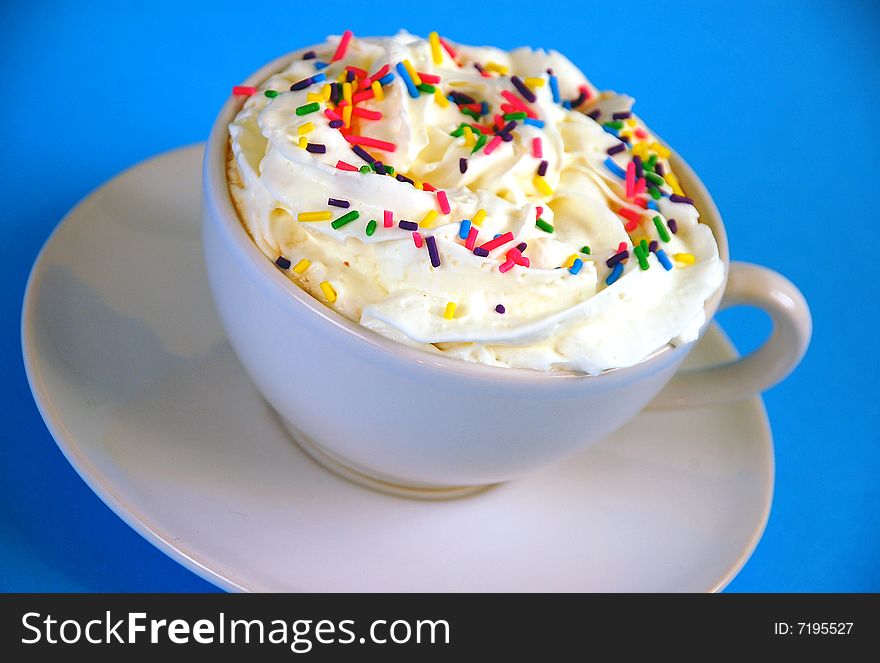 Foamy latte with whipped cream and sprinkles. Foamy latte with whipped cream and sprinkles