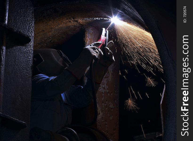 Worker arc welding close up. Worker arc welding close up