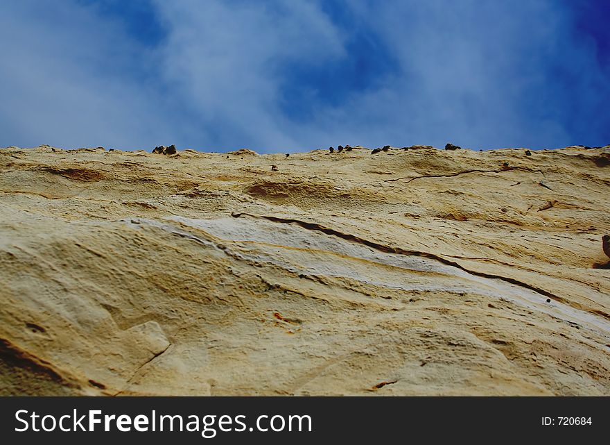 Rock with blue sky and clouds