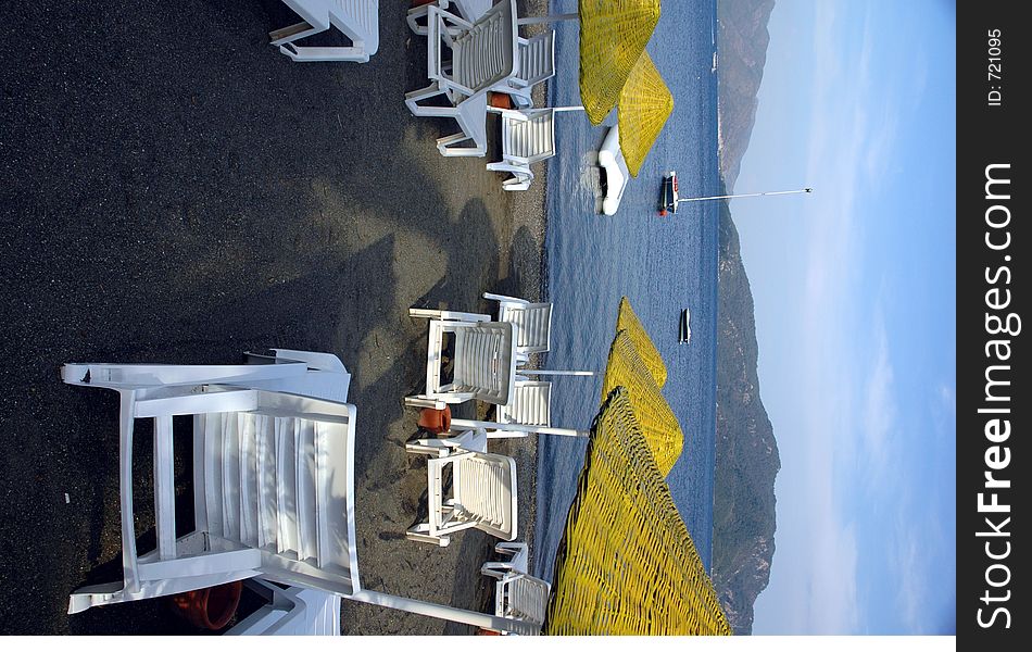 Beach in the morning with yellow umbrellas. Beach in the morning with yellow umbrellas